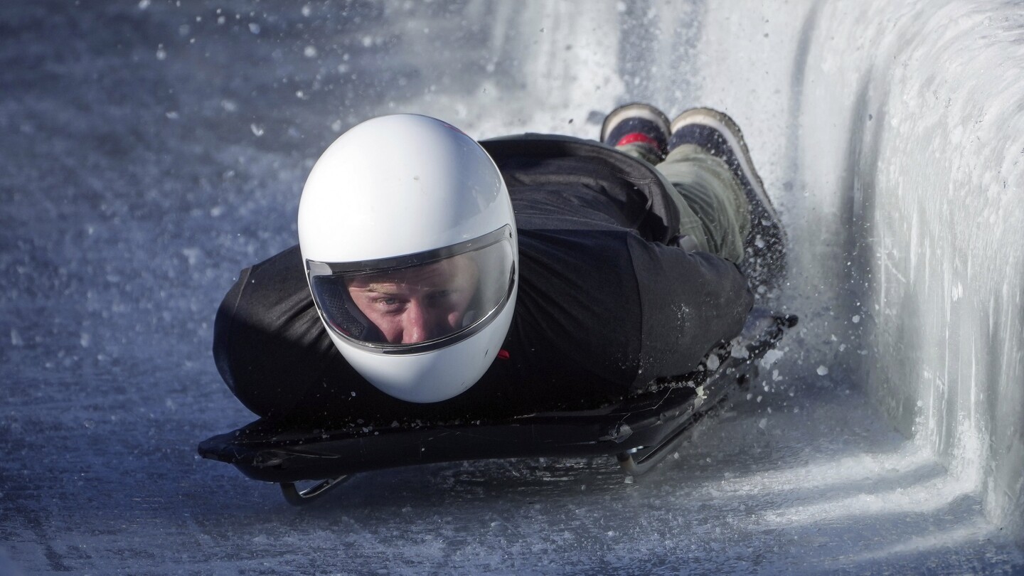 Prince Harry races down a sled track and says ‘everybody should do this’