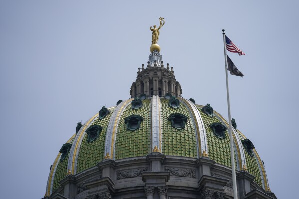 Miss Penn sits on top of the dome at the Pennsylvania Capitol in Harrisburg, Pa., Thursday, June 29, 2023. A senior adviser to Pennsylvania Gov. Josh Shapiro who abruptly resigned Wednesday, Sept. 27, 2023, had been accused earlier this year of sexual harassment by a coworker who said his behavior forced her to quit her job in the governor's office. (AP Photo/Matt Rourke)