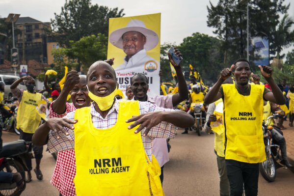 Supporters of Ugandan President Yoweri Kaguta Museveni celebrate in Kampala, Uganda, Saturday Jan. 16, 2021, after their candidate was declared winner of the presidential elections. Uganda’s electoral commission says longtime President Yoweri Museveni has won a sixth term, while top opposition challenger Bobi Wine alleges rigging and officials struggle to explain how polling results were compiled amid an internet blackout. In a generational clash widely watched across the African continent, the young singer-turned-lawmaker Wine posed arguably the greatest challenge yet to Museveni.  (AP Photo/Jerome Delay)