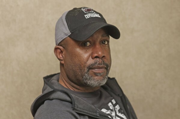 Darius Rucker poses for a photo before taking the stage. Sunday, Feb. 2, 2020 in Miami. Rucker and his band played the On Location Experiences' pregame tailgate party before Super Bowl LIV. (AP Photo/John Carucci)