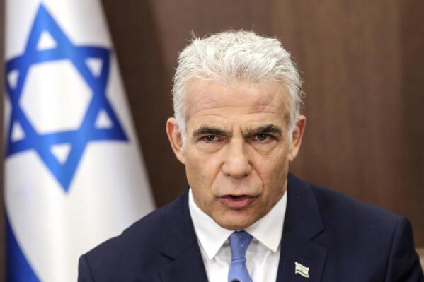 FILE - Israel's caretaker Prime Minister Yair Lapid heads a cabinet meeting in Jerusalem on July 31, 2022. Lapid took a gamble with his pre-emptive strike against Islamic Jihad militants in Gaza, less than three months before he competes in general elections to retain his job. (Gil Cohen-Magen/Pool Photo via AP, File)