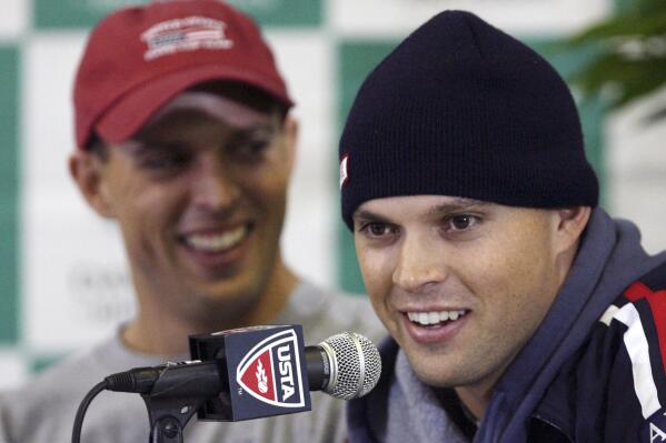 FILE - Bob Bryan, right, makes remarks while his brother Mike Bryan looks on during a news conference following their victory over Nikolay Davydenko and Igor Andreev, of Russia, in a doubles match at the Davis Cup tennis final Saturday, Dec. 1, 2007, in Portland, Ore. Bob Bryan is the new captain of the U.S. Davis Cup team. The U.S. Tennis Association is announcing the appointment on Monday, March 13, 2023. (AP Photo/Rick Bowmer, File)