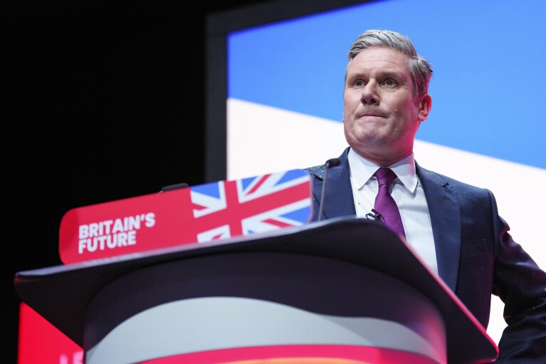 FILE - Britain's opposition Labour Party leader Keir Starmer delivers his keynote speech at the Labour Party conference in Liverpool, England, Tuesday, Oct. 10, 2023. The United Kingdom is poised to hold its first election in five years in a country battered by a cost-of-living crisis, fallout from the Israel-Hamas conflict and deep divisions over how to deal with migrants and asylum seekers crossing the English Channel from Europe on small inflatable boats. (AP Photo/Jon Super, File)