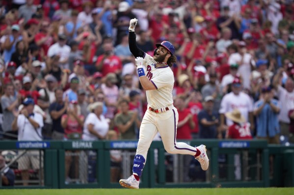 Philadelphia Phillies' Bryce Harper reacts after hitting a two-run home run against Los Angeles Angels pitcher Matt Moore during the eighth inning of a baseball game, Wednesday, Aug. 30, 2023, in Philadelphia. (AP Photo/Matt Slocum)