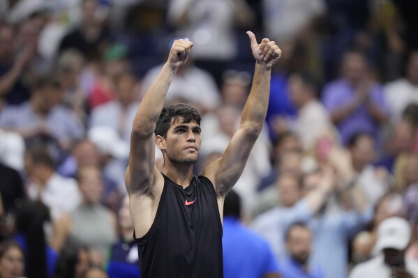 Carlos Alcaraz of Spain, reacts after defeating Li Tu, of Australia, during the first round of the U.S. Open tennis championships, Tuesday, Aug. 27, in New York. 2024. (AP Photo/Matt Rourke)