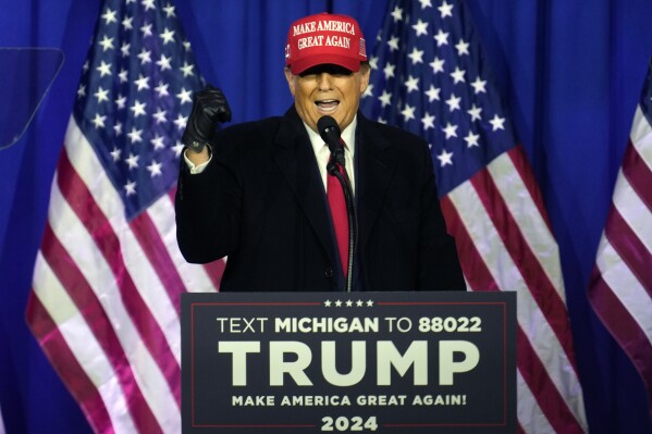 FILE - Republican presidential candidate former President Donald Trump speaks at a campaign rally in Waterford Township, Mich., Feb. 17, 2024. Trump is urging Republican leaders in Michigan to target Black voters in the swing state. Trump met with Michigan GOP chair Pete Hoekstra last Tuesday, March 19, in Florida to strategize his reelection bid and keyed in on "nontraditional Republican voters," Hoekstra said Monday, March 25. (AP Photo/Paul Sancya, File)