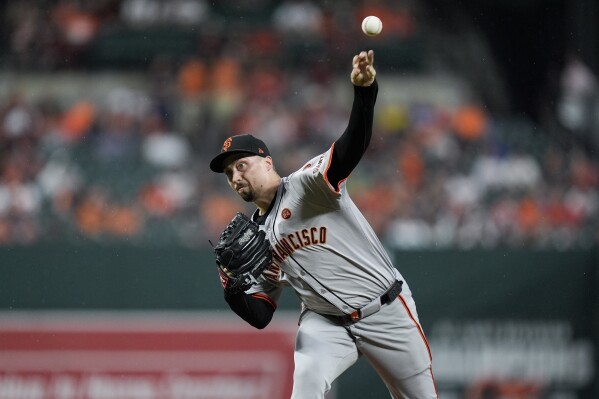 FILE - San Francisco Giants starting pitcher Blake Snell delivers during the first inning of a baseball game against the Baltimore Orioles, Sept. 17, 2024, in Baltimore. (AP Photo/Stephanie Scarbrough, File)