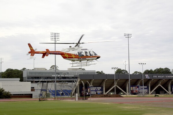 A Pafford EMS medical transport helicopter lifts off from outside Joe Aillet Stadium on the Louisiana Tech University campus to transport a victim from a morning stabbing incident that took place at the Lambright Sports & Wellness Center, in Ruston, La., Monday, Nov. 13, 2023. (Caleb Daniel/Ruston Daily Leader via AP)