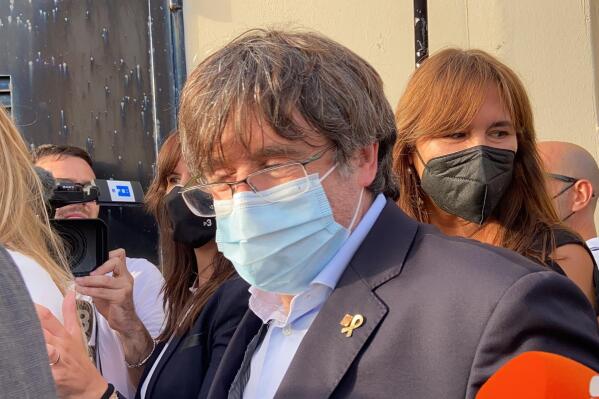 Catalan leader Carles Puigdemont, leaves the jail of Sassari, in Sardinia, Italy, Friday, Sept. 24, 2021. Puigdemont, sought by Spain for a failed 2017 secession bid, on Friday was released following a court hearing, ahead of an Italian court decision on Spain's extradition request, a day after Italian police detained him in Sardinia, an Italian island with strong Catalan cultural roots and its own independence movement. (AP Photo/Gloria Calvi)