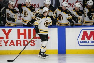 Boston Bruins forward David Pastrnak (88) celebrates his goal during the third period of an NHL hockey game against the Buffalo Sabres, Thursday, March 18, 2021, in Buffalo, N.Y. (AP Photo/Jeffrey T. Barnes)