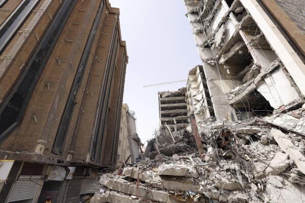 In this photo released by official website of the office of Iranian Senior Vice-President, on Friday, May 27, 2022, ruins of a tower at under construction 10-story Metropol Building remains after it collapsed on Monday, in the southwestern city of Abadan, Iran. Rescue teams at the site of the tower pulled five more bodies from the rubble on Friday, bringing the death toll in the disaster to 24. (Iranian Senior Vice-President Office via AP)