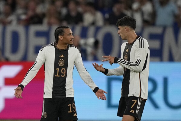 Germany's Leroy Sane, left, argues with his teammate Kai Havertz after Colombia's Luis Diaz scores his side's opening goal during an international friendly soccer match between Germany and Colombia at Veltins-Arena, in Gelsenkirchen, Germany, Tuesday, June 20, 2023. (AP Photo/Martin Meissner)