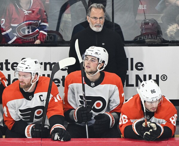 Philadelphia Flyers head coach John Tortorella looks on from the bench during the first period of an NHL hockey game against the Montreal Canadiens in Montreal, Tuesday, April 9, 2024. (Graham Hughes/The Canadian Press via AP)