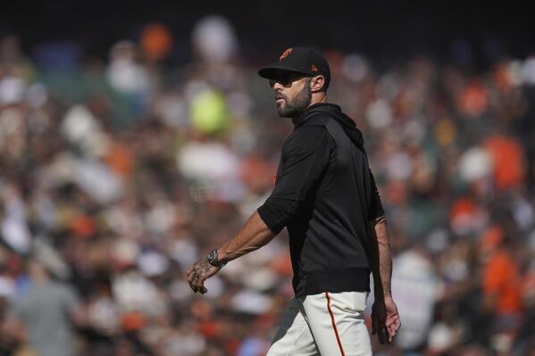 San Francisco Giants manager Gabe Kapler walks toward the dugout after making a pitching change during the fifth inning of his team's baseball game against the Arizona Diamondbacks in San Francisco, Sunday, Oct. 2, 2022. (AP Photo/Jeff Chiu)
