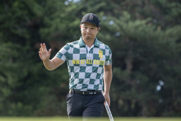 Jinichiro Kozuma of Iron Heads GC reacts to his putt on the 10th green during the first round of LIV Golf Adelaide at the Grange Golf Club Friday, April 26, 2024, in Adelaide, Australia. (Charles Laberge/LIV Golf via AP)