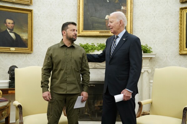 FILE - President Joe Biden meets with Ukrainian President Volodymyr Zelenskyy in the Oval Office of the White House, Sept. 21, 2023, in Washington. The White House says Biden has been in touch with U.S. allies and partners to discuss continued support for Ukraine in its fight against Russia. Tuesday's conversation came after Biden signed legislation late Saturday to keep the U.S. government funded. (AP Photo/Evan Vucci, File)