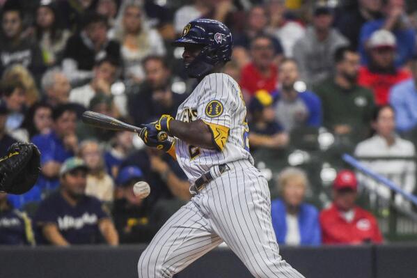 Tellez homers twice, Brewers hang on to outlast Reds 7-6