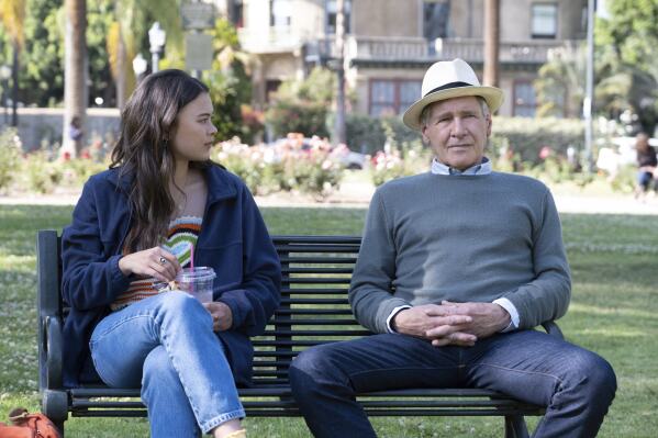 This image released by Apple TV+ shows Lukita Maxwell, left, and Harrison Ford in a scene from 