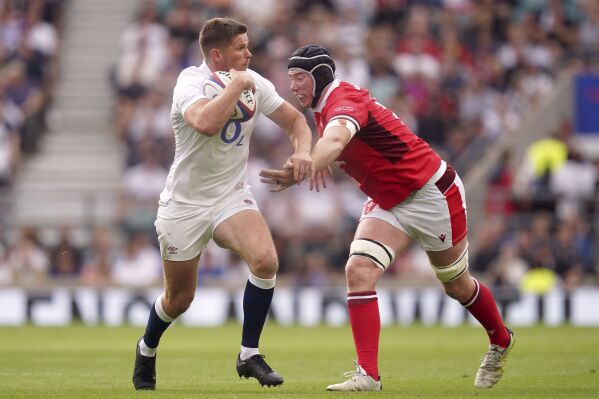 England's Owen Farrell and Wales' Adam Beard, right, in action during the Summer Nations Series match between England and Wales at Twickenham Stadium, London, Saturday Aug. 12, 2023. (David Davies/PA via AP)