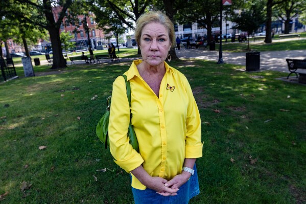 Deb Libby, who poses in Worcester, Mass., on Aug. 21, 2023, has been on the state waitlist for public housing for almost a year. In a state with some of the country's most expensive real estate, Libby is among the 184,000 people — including thousands who are homeless, at risk of losing their homes or living in unsafe conditions — on a waitlist for the state's 41,500 subsidized apartments. (Jesse Costa/WBUR via AP)