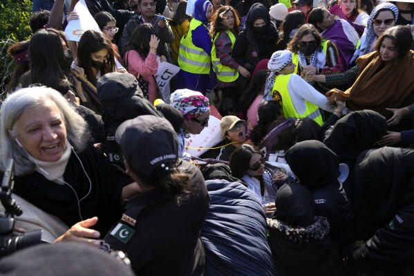 Activists from socialist-feminist organisation 'Women Democratic Front' lost their control during scuffing with female police officers at a rally to mark International Women's Day, in Islamabad, Pakistan, Friday, March 8, 2024. The day officially recognised by the United Nations in 1977, is celebrated around the world on March 8. (AP Photo/Anjum Naveed)