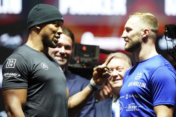 Anthony Joshua, left, and Otto Wallin during a press conference at OVO Arena, Wembley, London, Wednesday Nov. 15, 2023. Former two-time world heavyweight champion Anthony Joshua will face Otto Wallin of Sweden on Dec. 23 in Saudi Arabia, promoters said on Wednesday. (Adam Davy/PA via AP)