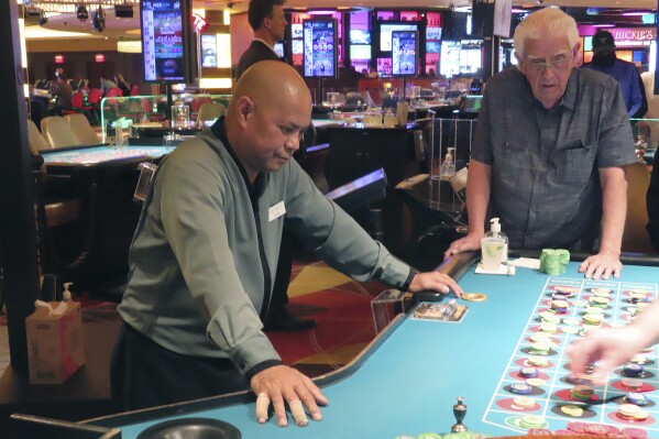 A dealer conducts a game of roulette at the Tropicana casino in Atlantic City, N.J. on May 12, 2022. On Friday, Sept. 15, 2023, New Jersey gambling regulators announced that the state's casinos, racetracks that accept sports bets and the online partners of both types of gambling won more than $531 million in August 2023, up almost 13% from a year earlier. (AP Photo/Wayne Parry)