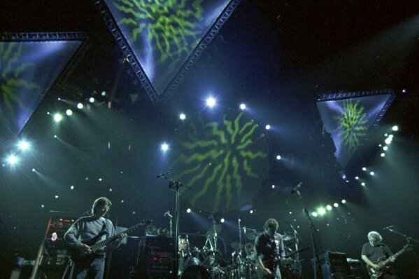 The Grateful Dead performs in Oakland, Calif., in 1993. The band has broken the record for the most Top 40 albums to chart on the Billboard 200. The Grateful Dead pulled out ahead of Elvis Presley and Frank Sinatra with 59 total Top 40 entries on the chart Monday following the No. 25 debut of their archival release “Dave’s Picks, Volume 49: Frost Amphitheatre, Stanford U., Palo Alto, CA (4/27/85 & 4/28/85).” (AP Photo/Eric Risberg, File)