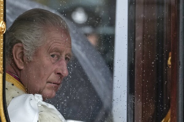 FILE - Britain's King Charles III makes his way to Westminster Abbey prior to his coronation ceremony in London Saturday, May 6, 2023. King Charles III has been diagnosed with a form of cancer and has begun treatment, Buckingham Palace says on Monday, Feb. 5, 2024. (AP Photo/Alessandra Tarantino, File)