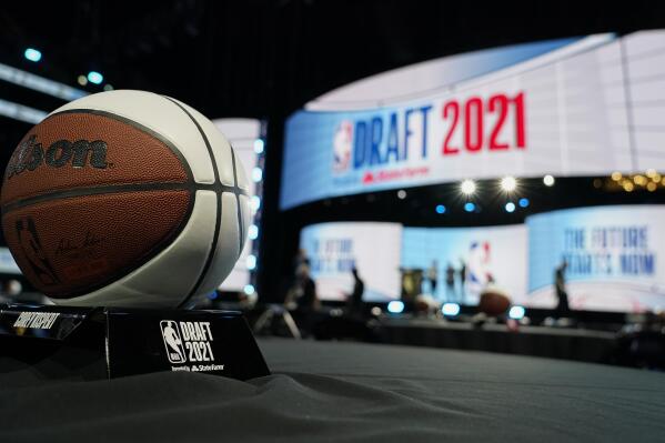 Stage crews prepare for the start of the NBA basketball draft, Thursday, July 29, 2021, in New York. (AP Photo/Corey Sipkin)