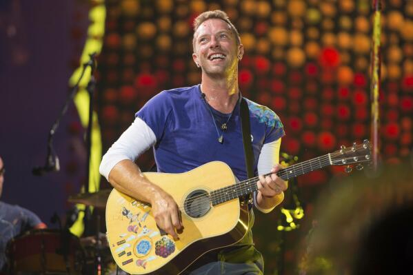 FILE - Chris Martin of Coldplay performs at Metlife Stadium on Aug. 1, 2017, in East Rutherford, N.J.  Coldplay's latest album, “Music of the Spheres,” releases Oct. 15.  (Photo by Scott Roth/Invision/AP, File)