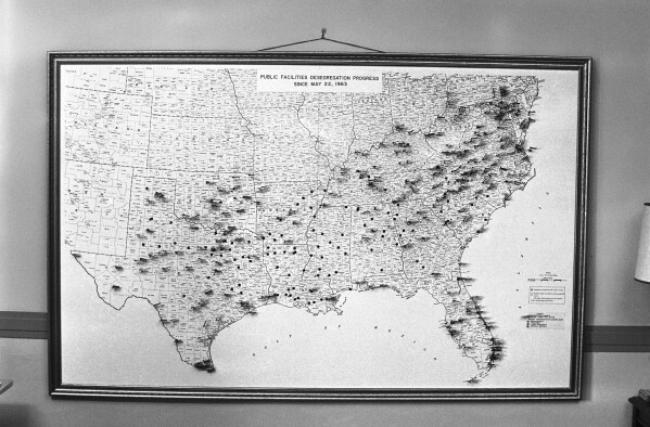 FILE - This map at the Justice Department pinpoints areas where progress has been made in desegregating public facilities, May 22, 1963 in Washington. (AP Photo/Bill Allen, File)