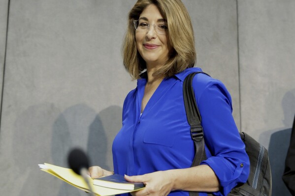 FILE - Naomi Klein arrives for a news conference at the Vatican on July 1, 2015. Books about how the dizzying impact of the internet and artificial intelligence are among finalists for a new book prize that aims to help fix the gender imbalance in nonfiction publishing. The six-book shortlist for the inaugural Women’s Prize for Nonfiction, announced Wednesday, includes Canadian author-activist Naomi Klein’s plunge into online misinformation, “Doppleganger,” and British journalist Madhumita Murgia’s “Code-Dependent: Living in the Shadow of AI.” (AP Photo/Andrew Medichini, File)
