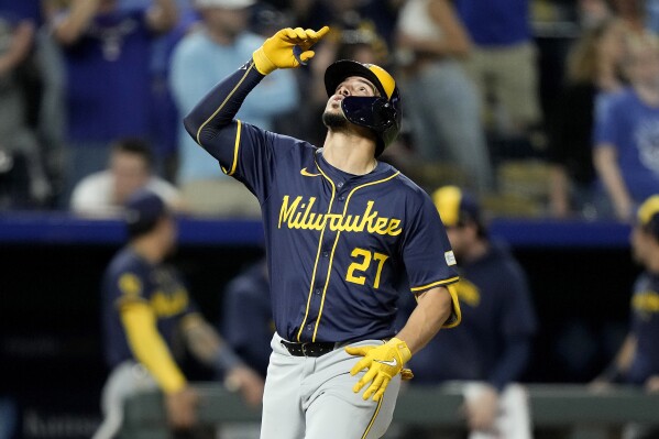 Milwaukee Brewers' Willy Adames celebrates as he crosses the plate after hitting a three-run home run during the ninth inning of a baseball game against the Kansas City Royals Tuesday, May 7, 2024, in Kansas City, Mo. The Brewers won 6-5. (AP Photo/Charlie Riedel)