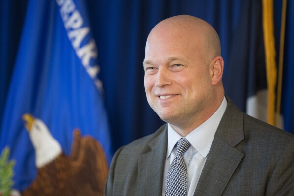 
              Acting U.S. Attorney General Matthew G. Whitaker smile as he speaks to area law enforcement officials at the U.S. Attorney's Office for the Western District of Texas in Austin, Tuesday, Dec. 11, 2018. (Jay Janner/Austin American-Statesman via AP)
            