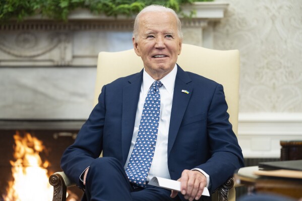 FILE - President Joe Biden speaks in the Oval Office of the White House, Feb. 27, 2024, in Washington. Biden on Feb. 28 is signing an executive order aiming to better protect Americans' personal data on everything from biometrics and health records to finances and geolocation from foreign adversaries like China and Russia. (AP Photo/Evan Vucci)