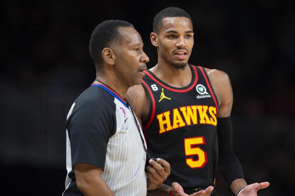 Atlanta Hawks guard Dejounte Murray talks to referee James Capers during the second half of an NBA basketball game against the Oklahoma City Thunder, Monday, Dec. 5, 2022, in Atlanta. (AP Photo/Hakim Wright Sr.)