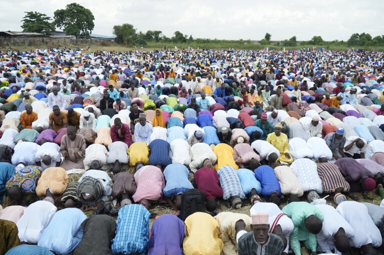 Muslims perform Eid al-Fitr prayers, marking the end of the fasting month of Ramadan in Lagos, Nigeria, Wednesday, April 10, 2024. (AP Photo/Sunday Alamba)