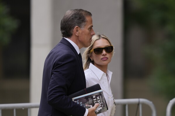 Hunter Biden, accompanied by his wife, Melissa Cohen Biden, arrive at federal court, Thursday, June 6, 2024, in Wilmington, Del. (AP Photo/Matt Rourke)