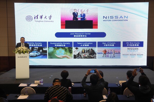 Masashi Matsuyama, vice president of Nissan Motor Co., Ltd. and president of Nissan (China) Investment Co., Ltd. speaks during a press conference to announce joint research with Tsinghua University in Beijing, Sunday, Dec. 17, 2023. Nissan is expanding its research ties with the leading Chinese university as it and other foreign car companies in China try to claw back market share from the country's burgeoning electric vehicle manufacturers. (AP Photo/Ng Han Guan)
