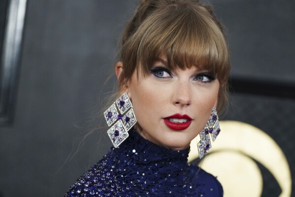 FILE - Taylor Swift arrives at the 65th annual Grammy Awards, Feb. 5, 2023, in Los Angeles. The pop star has officially earned more No. 1 albums than any other woman in history. Swift's re-recording of her 2010 album “Speak Now (Taylor's Version)," the third in her effort to re-record her first six albums, has officially debuted at No. 1 on the Billboard 200. (Photo by Jordan Strauss/Invision/AP, File)