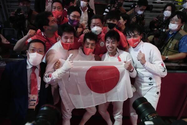 Japan team celebrate after winning a men's Epee team final at the 2020 Summer Olympics, Friday, July 30, 2021, in Chiba, Japan. (AP Photo/Andrew Medichini)