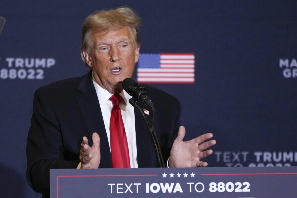 FILE - Former President Donald Trump speaks during a commit to caucus rally, Dec. 13, 2023, in Coralville, Iowa. Trump's lawyers are pressing to have special counsel Jack Smith's team held in contempt. The Republican former president's lawyers said Thursday, Jan. 4, 2024, prosecutors have taken steps to advance the 2020 election interference case against him in violation of a judge's order that put the case on hold. (AP Photo/Charlie Neibergall)