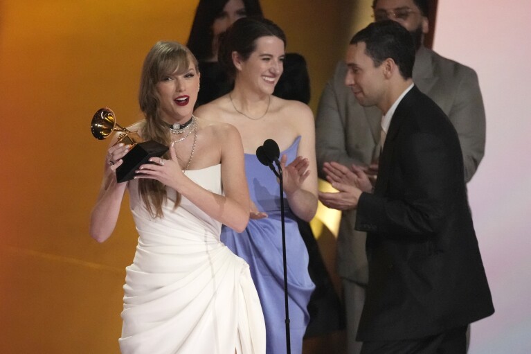 Taylor Swift accepts the award for album of the year for 