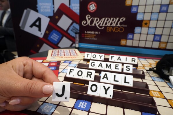 A Scrabble game with larger tiles is displayed at the 2023 Toy Fair, in New York's Javits Center, Monday, Oct. 2, 2023. Toymakers are tweaking original classic games or coming out with new ones that embrace an audience that's been around for a while: people over 65 years old. (AP Photo/Richard Drew)