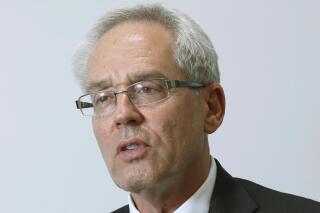FILE - In this Sept. 8, 2020, file photo, former Nissan Motor Co.'s executive Greg Kelly speaks during an interview in Tokyo. Kelly, on trial in Japan on charges related to former Nissan Chairman Carlos Ghosn’s compensation, asserted his innocence Wednesday, May 12, 2021, testifying he had always acted legally and in the “best interests of Nissan.” (Kyodo News via AP, File)