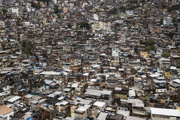 FILE - Houses built on a hill in the poor Rocinha favela in Rio de Janeiro, Brazil, September 30, 2022.  After decades of delay and pressure, Brazil announced on January 23, 2004 that it would henceforth 