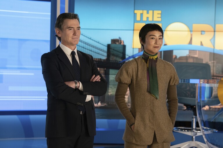 This image released by Apple TV+ shows Billy Crudup, left, and Greta Lee in a scene from 