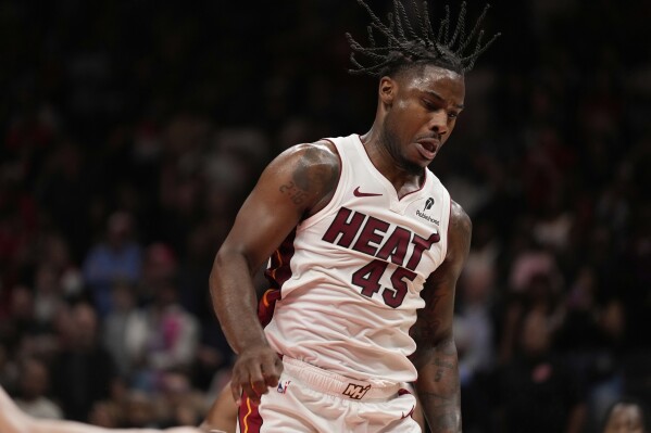 After slow start, Miami backup guard Davion Mitchell emerges as surprise OT  star in win over Hawks | AP News