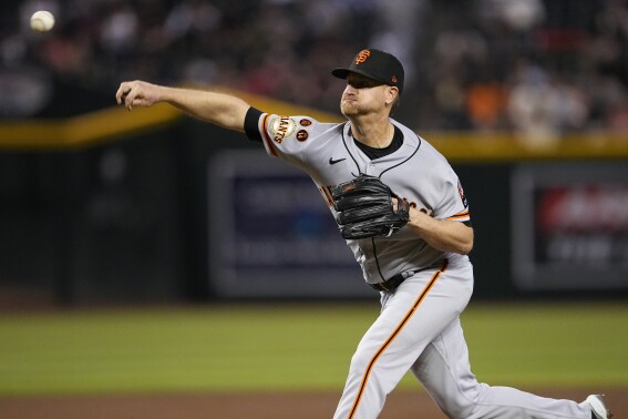 Abbott combines with Law on 2-hitter, Reds beat Giants 5-1 for 4